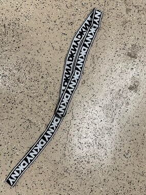 DKNY branded black and white stretchy belt.